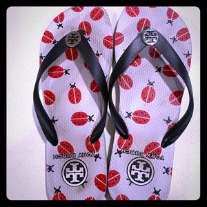Black and white Tory Burch flip flops